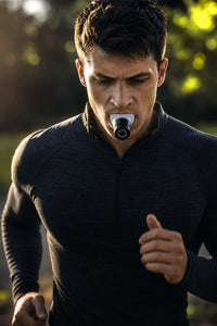 Athlete training with the Breath Performance Trainer
